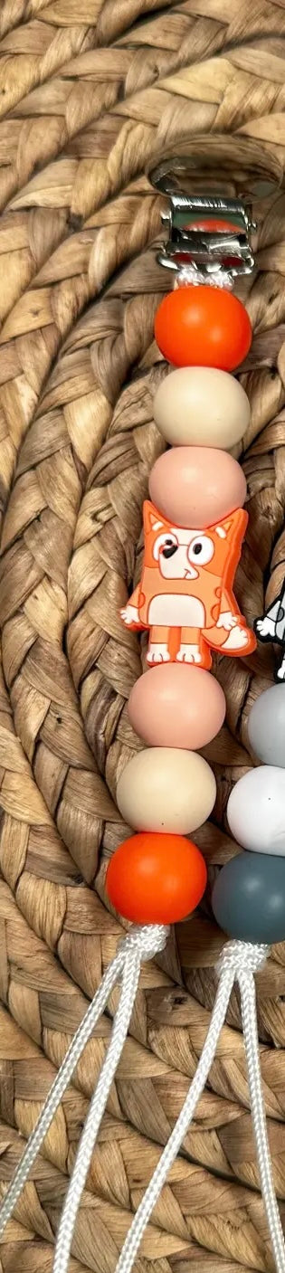 Orange dog paci clip